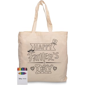 A beige tote bag featuring a Father’s Day design, accompanied by a set of colourful crayons.