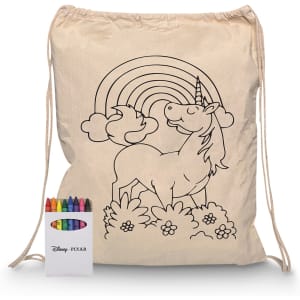 A cream drawstring bag featuring a unicorn and rainbow design, accompanied by a set of crayons in various colours.
