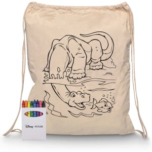 A natural canvas drawstring bag with a dinosaur illustration, accompanied by a set of coloured crayons in a branded box.