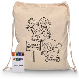 A beige drawstring bag featuring monkey illustrations and a crayon set with multiple colours.