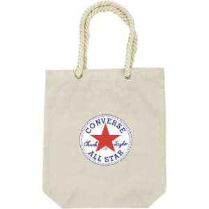 A cream tote bag with a round logo in blue and red, featuring a rope handle.