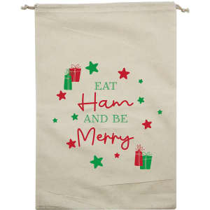 A cream Christmas ham bag featuring festive graphics with green and red gifts and stars, and text in a playful font.