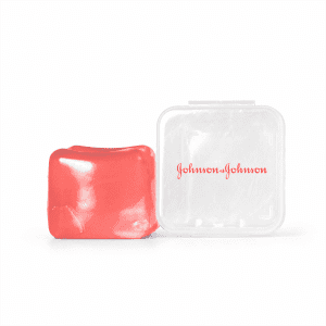 A red jelly cube sensory toy beside a transparent plastic case with a logo.