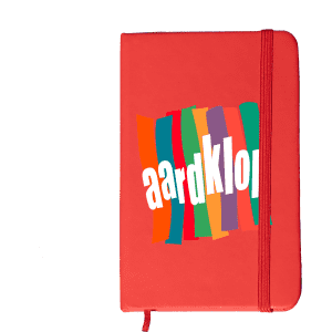 A red Minichroma A6 Notebook with a colourful design and an elastic band closure. It features a logo on the front.