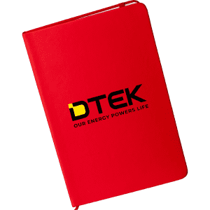 A red A5 notebook with a logo on the cover. The notebook has a smooth finish and is closed.