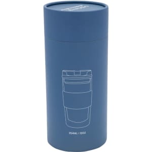 A reusable coffee cup in matte blue, featuring a sealed lid and a cup illustration on the packaging.