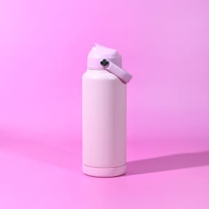 A drink bottle in light pink with a handle and a silver cap, featuring a logo.