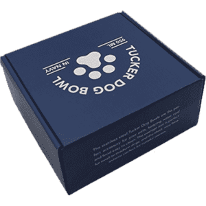 A navy blue box containing the Tucker Pet Bowl, featuring a paw print design and a logo.