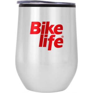A drink bottle in a silver stainless steel finish with a black lid and a red logo.