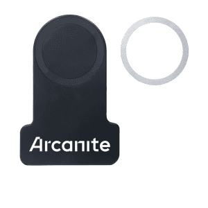 A wireless charger in black with a metallic ring and a logo.