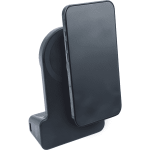 A black wireless charger with a slanted design and a mobile phone resting against it. It has a logo on the base.