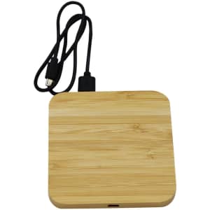 A bamboo wireless charging dock in a square shape, featuring a black USB cable for connection.