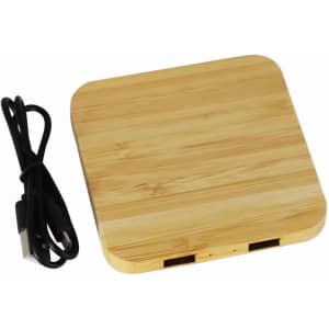 A bamboo wireless charging dock with two USB ports and a black charging cable.