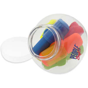 A transparent jug contains assorted highlighters in bright colours, including blue, pink, yellow, and orange.