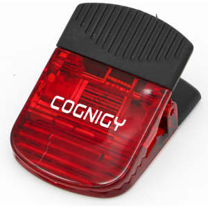 A red wide magnetic Croc clip with a black top, featuring a logo.
