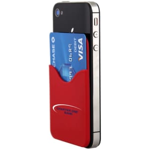 A red Smart Wallet attached to a smartphone, holding a blue credit/debit card. The product has a logo.