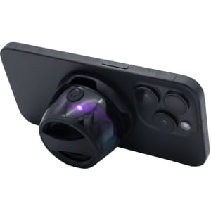 A speaker in black, designed to attach to a smartphone, featuring a rounded shape and a logo on the side.