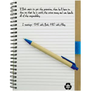 A recycled paper notebook with a brown cover, blue elastic band, and a pen resting on its pages.