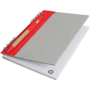 A grey recycled journal book with a red binding and a matching pen attached. The pages are lined and include a logo.