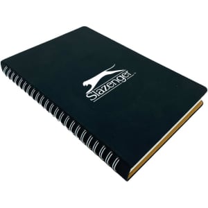 A black spiral notebook with a logo on the front and yellow edges.