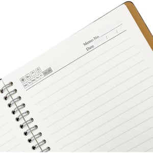 A spiral notebook with a brown cover, featuring blank lined pages and a section for notes and dates.