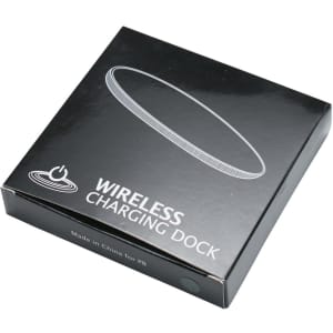 A black box containing a round wireless charging dock, featuring minimalist design and a logo.