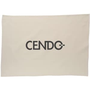 A cream cotton tea towel featuring a large black logo in the centre.