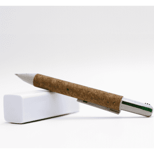 A cork pen with a metallic tip, resting on a white eraser. The pen has a natural brown cork casing.
