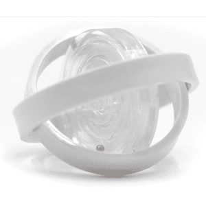 A clear fidget toy with a white band encircling a spinning inner component. Features a smooth, transparent design.