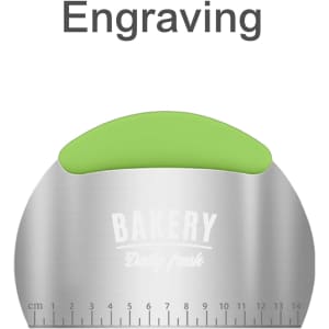 A flour cutter with measurements, featuring a stainless steel body and a green ergonomic grip. It has a logo.