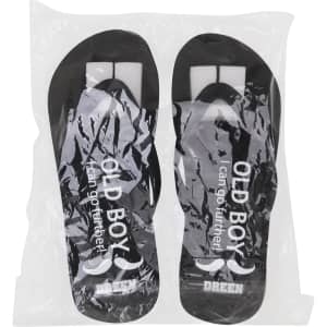 Black EVA classic thongs in protective packaging, featuring a logo and a simple design.