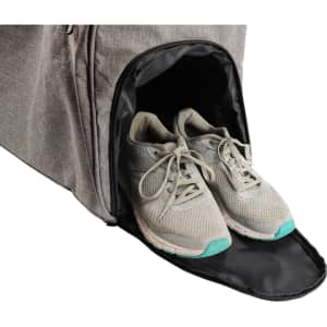 A grey wheeled duffel bag with a side compartment showcasing a pair of light grey athletic shoes.