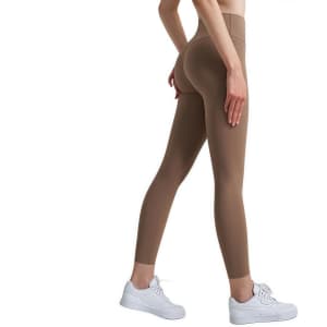 High-waisted elastic LYCRA leggings in a brown shade, worn with white sneakers, featuring a fitted design.