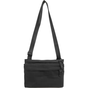 A lightweight black crossbody bag with an adjustable strap and multiple zippered compartments. It features a logo.