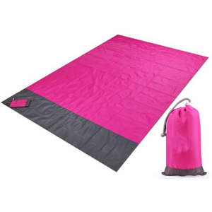 A medium pouch picnic blanket in vibrant pink with a black bottom, accompanied by a matching storage pouch.