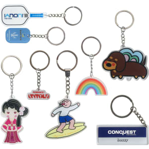 A variety of custom shape acrylic keyrings in vibrant colours, featuring unique designs and a logo on one.