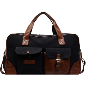 A vintage canvas duffle bag in black with brown leather accents and two front pockets. Features a logo.