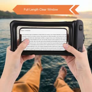 A waterproof cellphone dry bag in black, featuring a clear window and held by a person against a scenic backdrop.