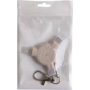 A wheat straw 3-in-1 data blocker with a keyring, packaged in a clear pouch. The product is light pink in colour.