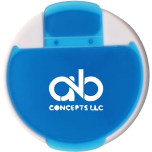 A round pill box in white and blue with a flip-top lid and a logo on the front.