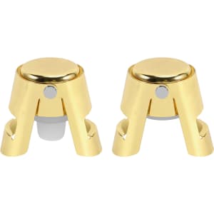 A stainless steel champagne stopper in gold, featuring a sleek design with a shiny finish and a small logo.