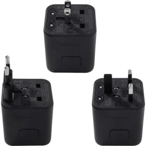 A compact black travel adapter featuring multiple plug types for international use, with an attached logo.