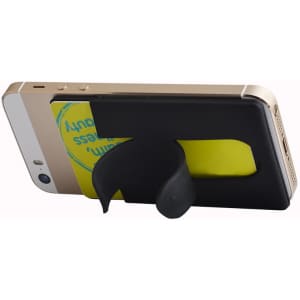 A black wallet stand attaches to a phone, holding a card, positioned against a light background.
