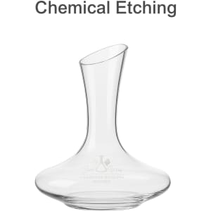A glass wine decanter with a curved body and a tall neck, featuring a logo etched on the surface.