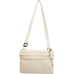 A lightweight crossbody bag in cream, featuring a zippered compartment and an adjustable strap.