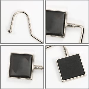 A square curved desk hook in silver and black, featuring a sleek design with a glossy finish and a branding logo.