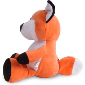 An orange and white fox plush toy with black accents, sitting upright. It has a small branding tag attached.