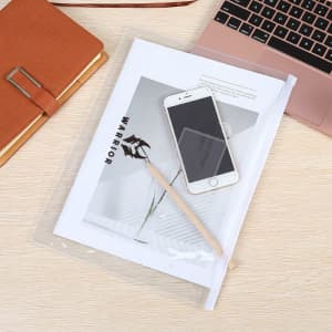 A transparent A4 file bag with documents, a phone, a pencil, and a notebook on a wooden surface.