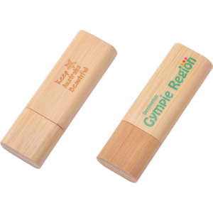 Rounded wooden flash drives in natural bamboo colour, featuring engraved logos on the surface.