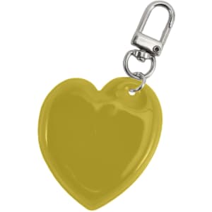A yellow heart-shaped reflective keychain with a silver clip attachment. It has a smooth, glossy surface.